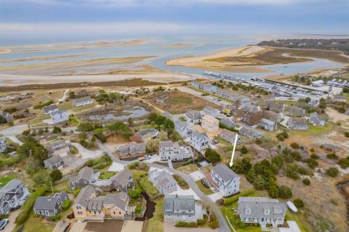an aerial view of a residential estate next to the water at Slow M'Ocean – A Fresh Take on Cape Calm in Chatham