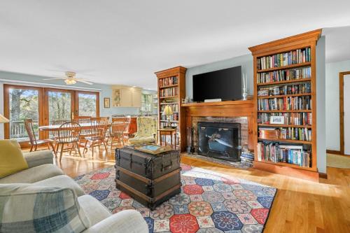 a living room with a fireplace and a tv at Spacious Dog-Friendly Retreat in Chatham in Chatham