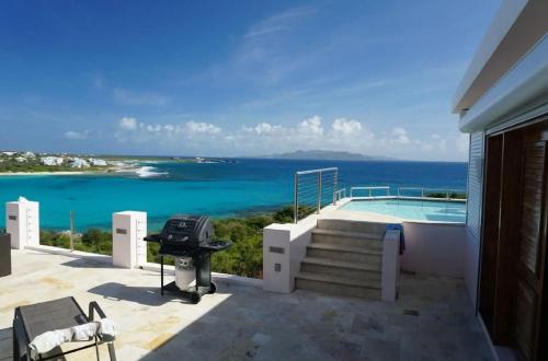 a view of the ocean from the balcony of a house at Spectacular views in Long Path