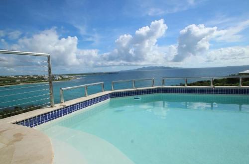 a swimming pool with a view of the water at Spectacular views in Long Path
