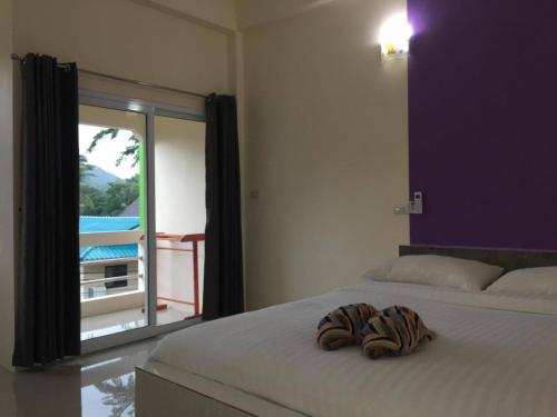 Postel nebo postele na pokoji v ubytování Budchui Guesthouse