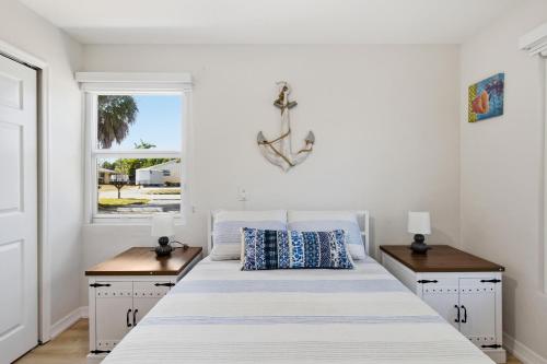 a bedroom with a large bed with two night stands at Naples Triplex Retreat in Naples