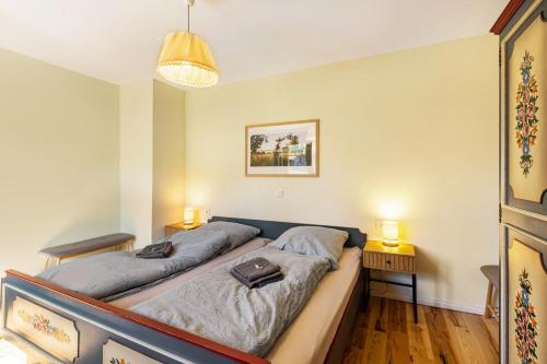 a bedroom with two beds and two lamps on two tables at Ferienwohnung am Bertenberg -Keßler in Diemelsee
