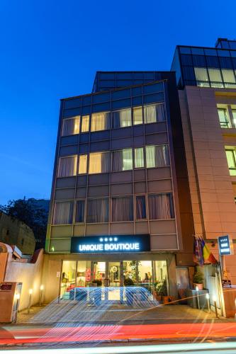 a building with a store on the side of it at Unique Boutique in Bucharest