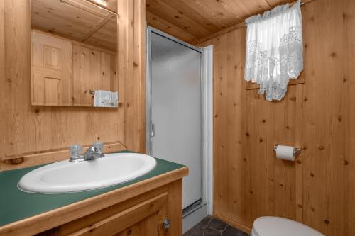 a bathroom with a sink and a shower at Sun Outdoors Canyonlands Gateway in Moab