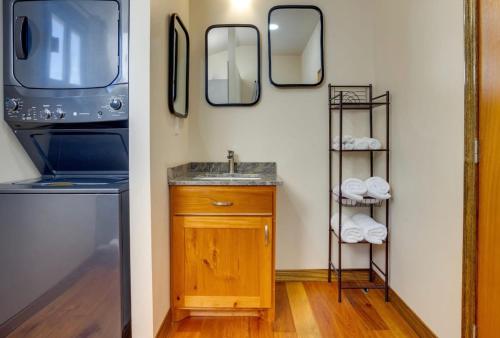 a bathroom with a sink and two mirrors at Tortuga Amarilla 1 in Maya Beach
