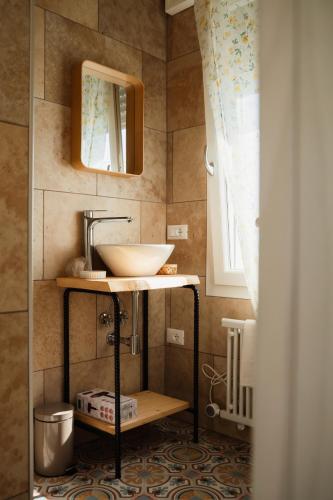 a bathroom with a sink and a mirror at Ca' Foega rooms in Chioggia