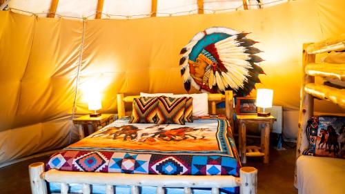 a bedroom with a bed in a tent at Orr Family Farm & RR, LLC in Oklahoma City