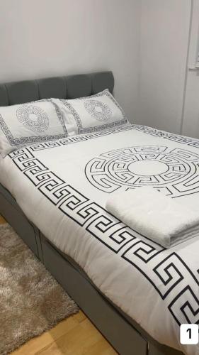 a bed in a room with a white mattress at PLUS Properties Oxford 1 in Stoke on Trent