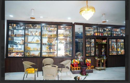 a store with tables and chairs in a room at rajapalace in Zahirābād