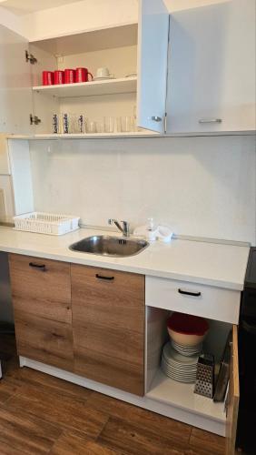 a kitchen with a sink and a counter top at Sunny House Byala in Byala