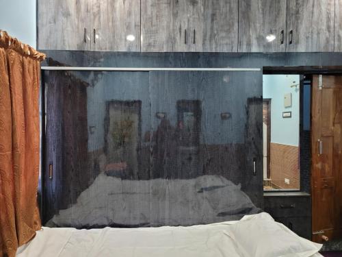a bedroom with a painting on the wall at The Fortune Mango in Jajpur Road