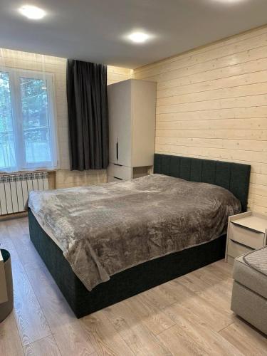 a bedroom with a large bed in a room at Bellissimo Garden Villa in Tsaghkadzor