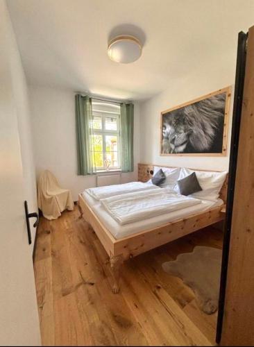 a bedroom with a large bed in a room at Casa Roberto, Apartment 1 in Mariazell