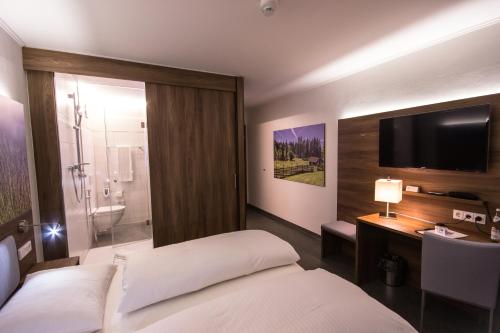 Cama o camas de una habitación en Hotel7Continents