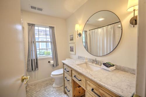 a bathroom with a sink and a mirror at Lake Views & Fire Pit in South Haven