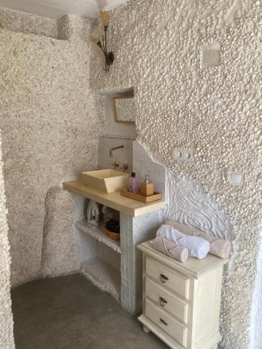 a small bathroom with a sink and a counter at Estudio Aryas nest 2 in Mijas