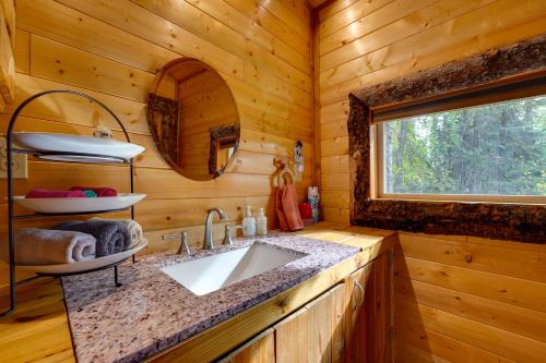 a bathroom with a sink in a log cabin at 3-Cabin Base w/ Lake Access: Dogs Welcome! in Soldotna