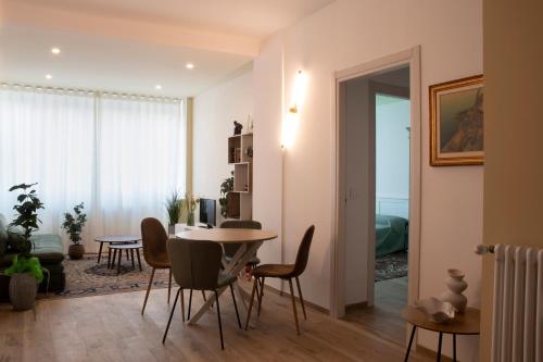 a living room with a table and chairs at the window in Domodossola