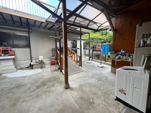 an open garage with a metal roof with a ramp at Yoshinogun - House - Vacation STAY 17051 in Yoshino