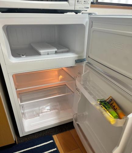 an open refrigerator with its door open and its drawer at Yoshinogun - House - Vacation STAY 17051 in Yoshino