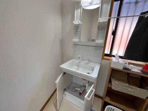 a bathroom with a sink and a mirror at Yoshinogun - House - Vacation STAY 17051 in Yoshino