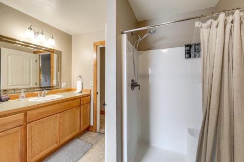 a bathroom with a shower and a sink at Columbia Falls Private Retreat: Pool Table & Deck! in Columbia Falls