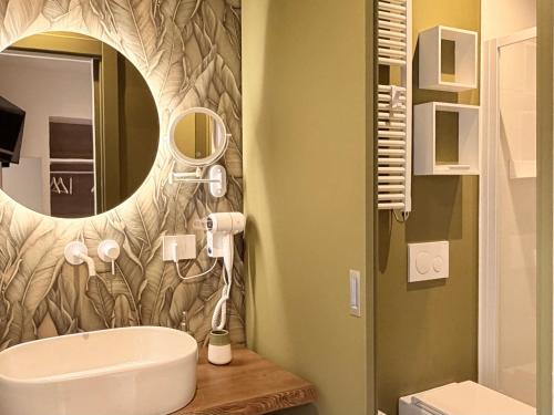 a bathroom with a sink and a mirror at Le Terrazze sul Fiume in Santa Sofia