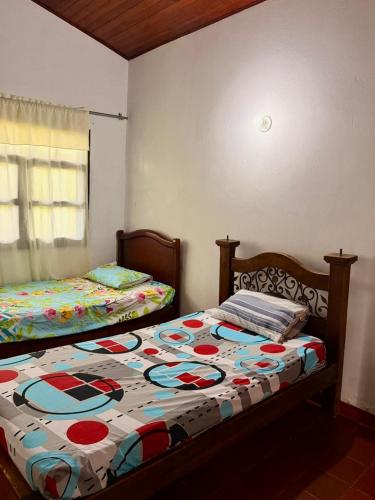 two beds sitting next to each other in a bedroom at Finca en La Cumbre in La Cumbre