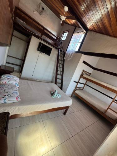 an overhead view of a room with two bunk beds at Pousada Vento Leste in Cabo Frio