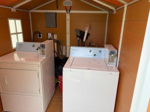 a washer and dryer in a small room at Cozy Haven your home away from home in Hollywood