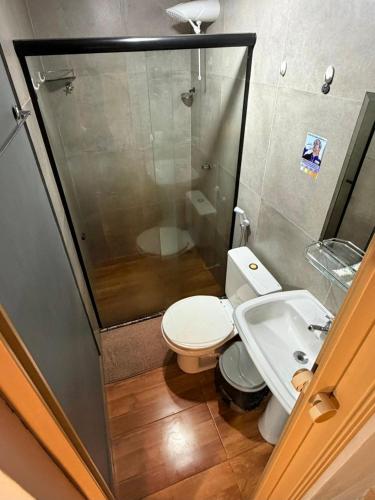 a bathroom with a toilet and a shower and a sink at Hospedaria Camarão da ilha in Fernando de Noronha