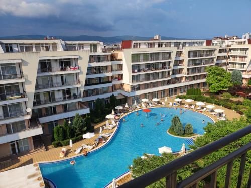 a view of a swimming pool in a resort at Luxury Penthouse Studio with Outdoor Hot Tub and Panoramic Views in Sunny Beach