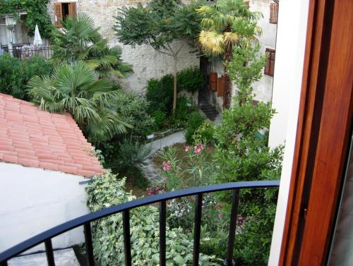 a view of a garden from a balcony at Apartments Bevk in Piran
