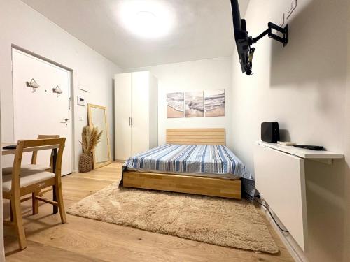 a bedroom with a bed and a chair in it at El mar in Ventimiglia