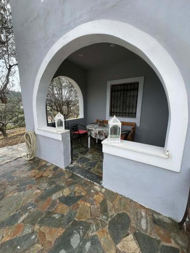 an archway in a building with a table in it at V&M Residence - Ground Level in Mesagrós
