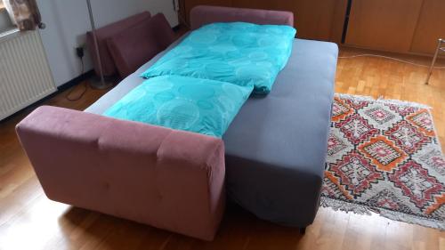 a couch and a chair in a living room at Werreufer Loft in Detmold