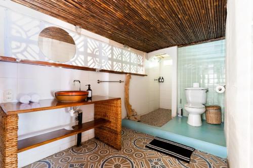 a bathroom with a sink and a toilet at Casa Marimba in La Laguna