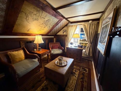 a living room with a couch and a table at A Williamsburg White House Inn in Williamsburg