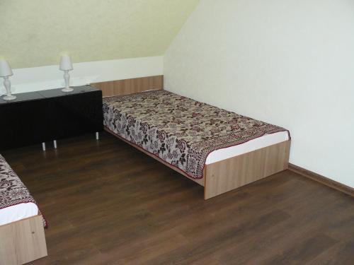 a bedroom with two beds and two night stands at Centro bustas in Kėdainiai