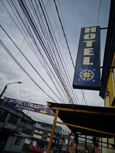 a building with a sign on the side of it at Hotel Girasol in Santa Rosa de Cabal