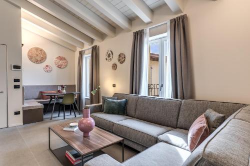 a living room with a couch and a table at Seety Spartaco in Milan