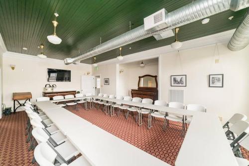 an empty room with white chairs and a piano at The Long Run - 2 CA King Sized Beds+ - Sleeps 8-10 in Lynchburg