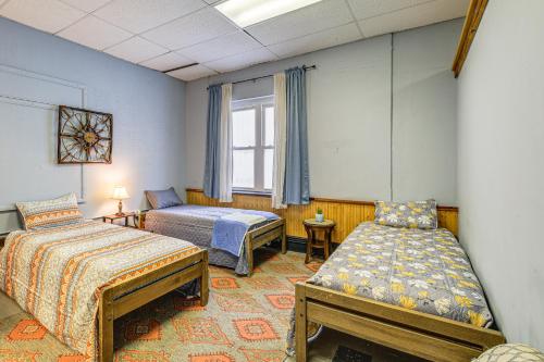 a bedroom with two beds and a window at Direct Warrior Trail Access! Ultimate ATV Getaway in Gary