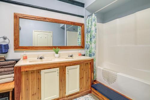 a bathroom with a sink and a mirror at Direct Warrior Trail Access! Ultimate ATV Getaway in Gary