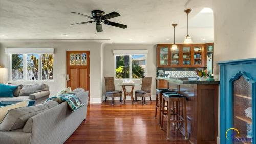 a living room with a couch and a kitchen at Ohana in Santa Cruz