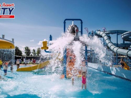 a child on a water slide at a water park at 158 Unity Beach Brean Sleeps 4 No pets sorry in Berrow