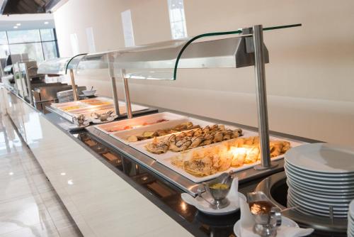a buffet line with many different types of food at Grand Hotel Neum Wellness & Spa in Neum