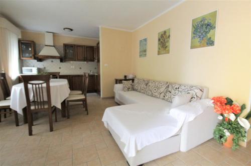a living room with a couch and a dining room at House Casa Fabris with Pool in Umag