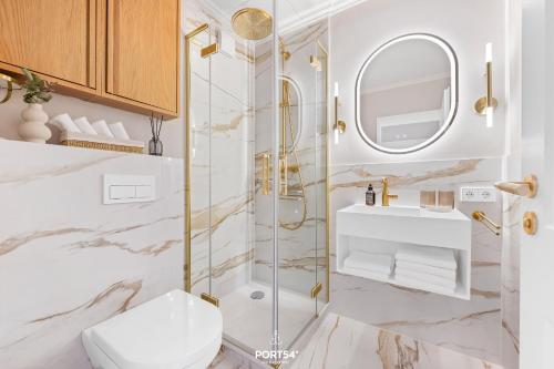 a bathroom with a shower and a toilet and a sink at Ferienwohnung Margaritha List auf Sylt in List